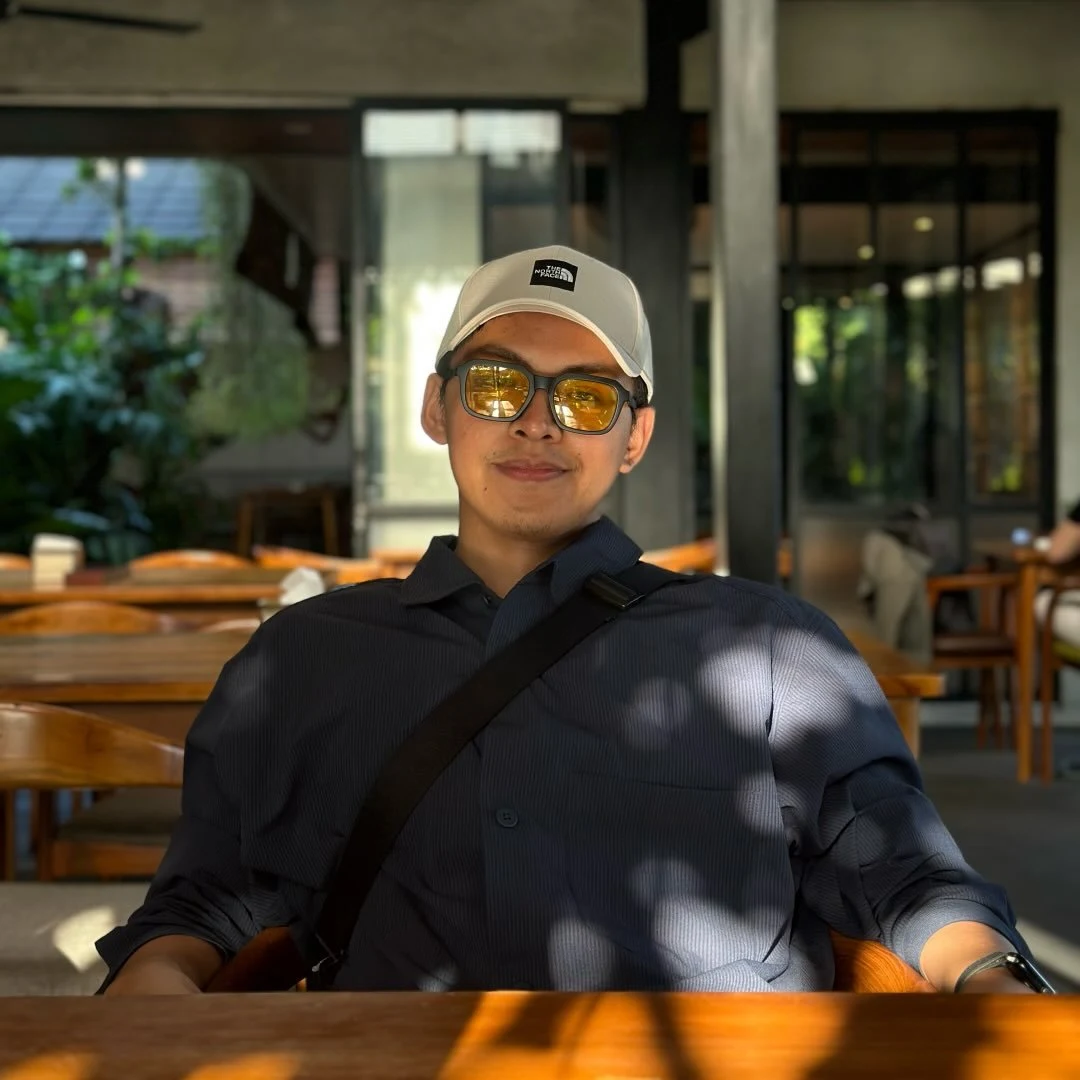 Bryan sitting at a café